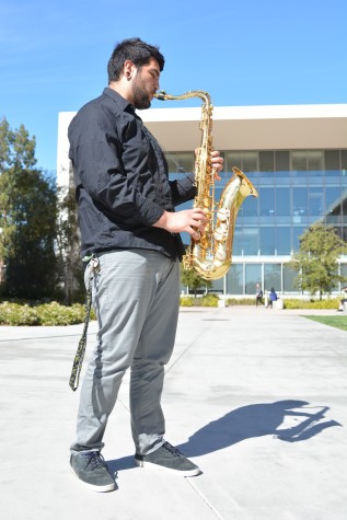 Enrique Mora-Tora poses with his saxophone outside the Math, Business and Allied Health Building. Mora- Tora is part of the El Camino Jazz Band and has been playing the saxophone since he was 12 years old. Photo: John Fordiani/ Union