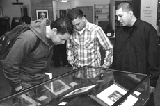 From left to right, Paul Salgado, 33, criminal justice major, Robert Ruvalcaba, 19, fire and emergency technology major and Luis Guzman, 18, undecided major take time to appreciate  the student photography display.