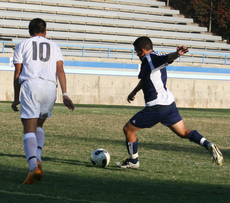 Tony Sandoval, freshman forward, winds up as he prepares to kick the ball toward the goal. Photo by Ivan Santiago.