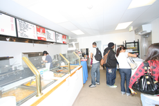 Students buy food at the new Munchy deli located in the Manhattan Beach Boulevard Modules. This new food service location offers more variety and healthier options.