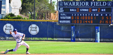 Freshman shortstop Jeff Miera fields a ground ball for the last out in an April 21 victory over L.A. City, as the scoreboard shows a dominant outing as the Warriors ended their six-game losing streak.
