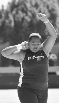 Na'i Leni warms up for the shot put event at Mt. San Antonio College Saturday. 