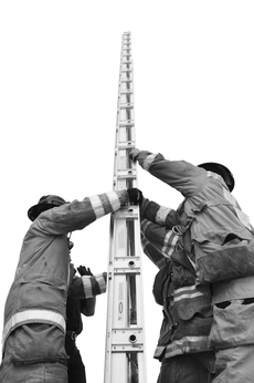 Fire Academy students learn to set up a ladder during training