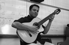 Chris Mello, guitar instructor, teaches guitar while providing students with real-life experience.