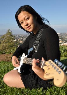 Natasha Sazuki strums her guitar atop Rocketship Park in sunny Torrance.