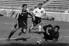 Making it through Pasadena City's defense, Tony Sandoval scores for the Warriors. They took home the victory at 5-3.