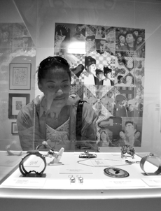 Deceny Jones, 19, art history major, looks on at jewelry made  by EC art students.