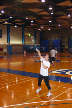 EC badminton player Angie Hoang, 23, slams the shuttle-cock during a practice in the North Gymnasium.  Hoang progressed from the No. 3 player on the team to the No. 1 player on the team during her first season playing badminton.