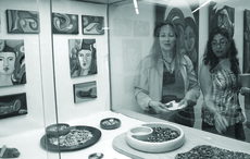 A display at the Schauerman Library, showcases the work of Spaninsh instructor Claudia Prada (right). Her work, "Untitled" combines rock and wood is symbolic of movement and revitalization.