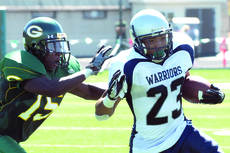 Kevin Norrell, wide-reciever, shakes a tackle on his way to the end zone. EC passed for over 267 yards coming back from a 7-0 defecit against Grossmont College in the first half. The Warriors defeated the Griffins, 21-14 last Saturday.