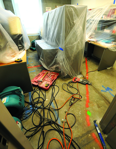 Hardware, wires and plastic  fill the closed-off hallway by the Writing Center in the Humanities Building as faculty offices undergo major repairs from the flooding and water damage.