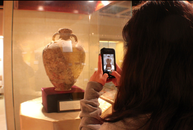 Kimberli Shigeta,20, Nursing majors snaps a photo of the Roman Amphora