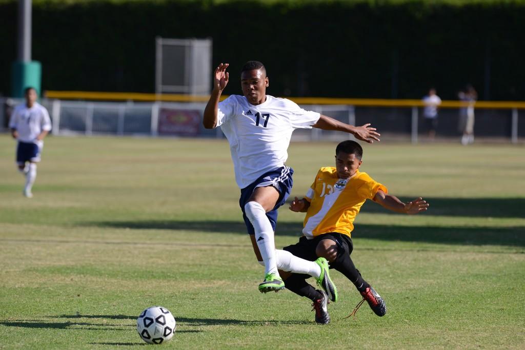 Derrick Hamilton, #17, Forward,  running down the field trying to get a goal.