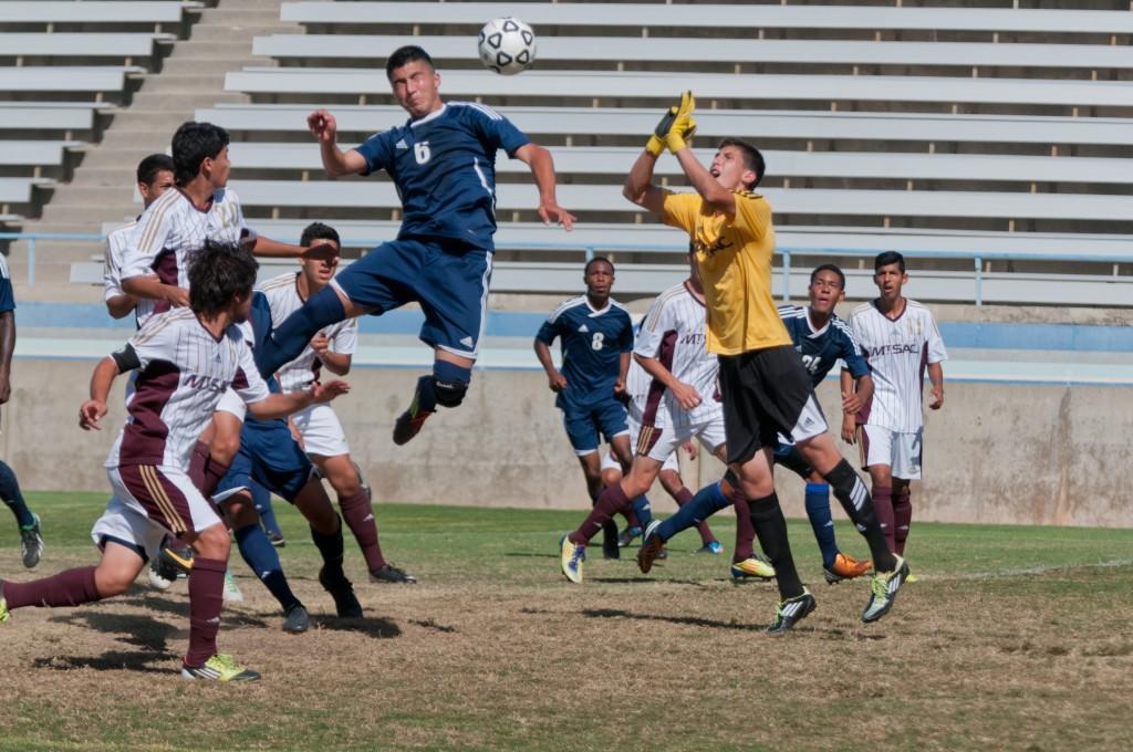 Andredavy Cervantes, #6, Midfield, takes flight for a header.