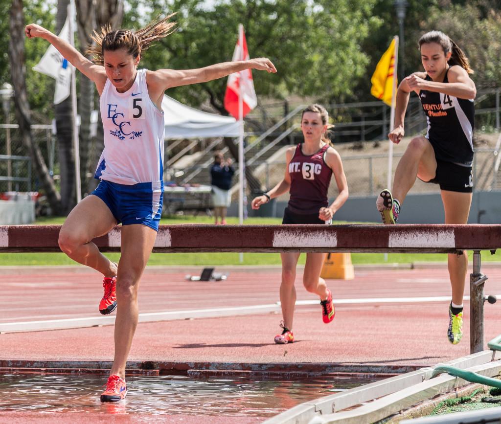 Freshman Haley Heinemann clears the water jump during her 2nd lap in the Women's 3000 meter steeplechase at last Saturday's meet at Mt. San Antonio College. Heinemann would place 2nd out of a field of 17 runners in the race with a time of 11:33.48. This was only Heinemann's 2nd appearance in this event and yet the time was good enough to place her  2nd place overall in the South Coast Conference as well as place her 3rd overall among the all-time El Camino College performers in the event. Photo credit: Gilberto Castro
