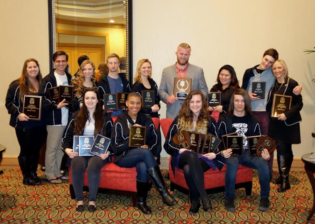 ECs debate team posing with their awards after a first-place finish at Phi Rho Pi Nationals in Denver earlier last month.