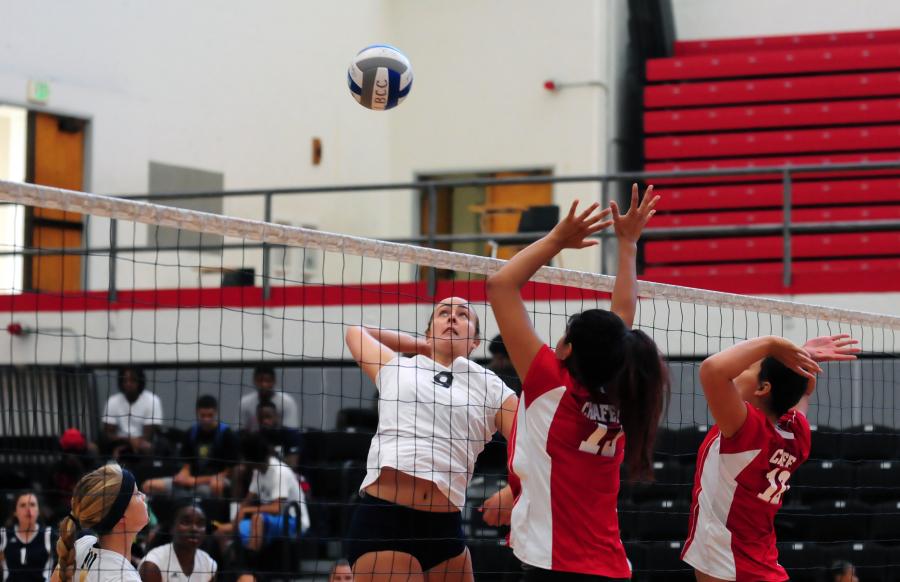 Sophomore middle blocker Kimberly Haney, spikes a ball over Chaffey College gains EC a point in their 3-0 win over Chaffey College on Sept. 5 at the  Long Beach City College Quad Tournament.