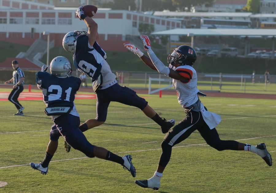 Sophomore defensive back Michael Jurado catches an interception in the third quarter of last Saturday’s game against Ventura College at the Warriors’ temporary home field, Redondo Union High School’s Sea Hawk Bowl. The hard-fought contest ended in a 30-33 loss for the Warriors. Photo credit: Gilberto Castro