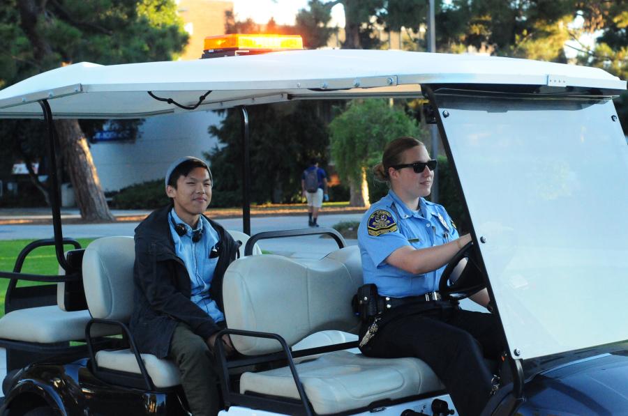 Daniel Duong,19, computer science major, is escorted to the Humanities Building by Community Service Officer Hannah Jessop of the El Camino Police Department. Photo credit: Amira Petrus