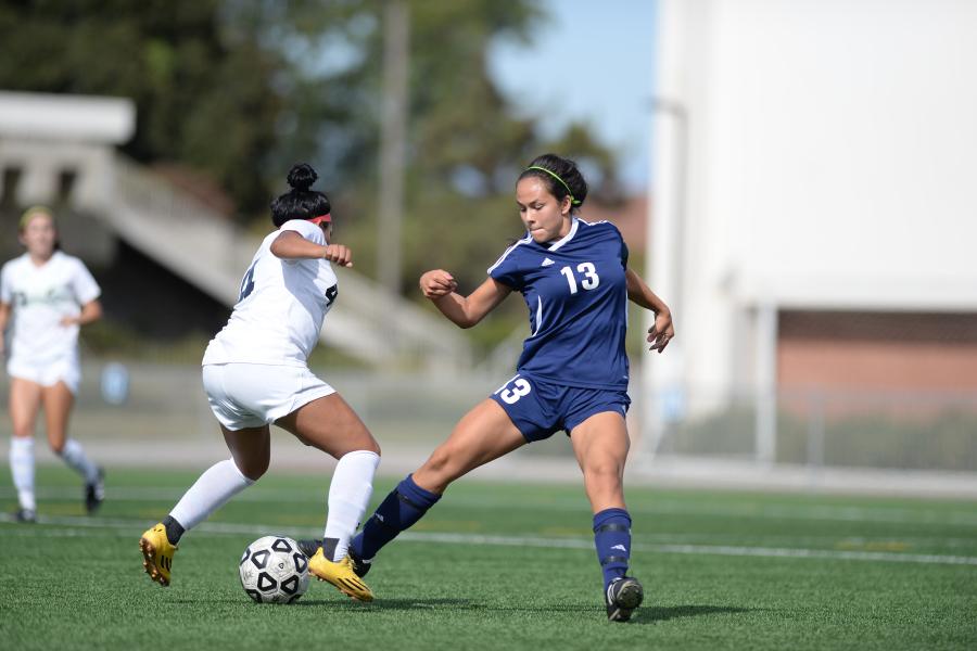 EC forward Tatiana Granados (13) fights for control of the ball during the Warriors game against East Los Angeles College last Friday. The Warriors went on to lose 5-0. Photo credit: Charles Ryder