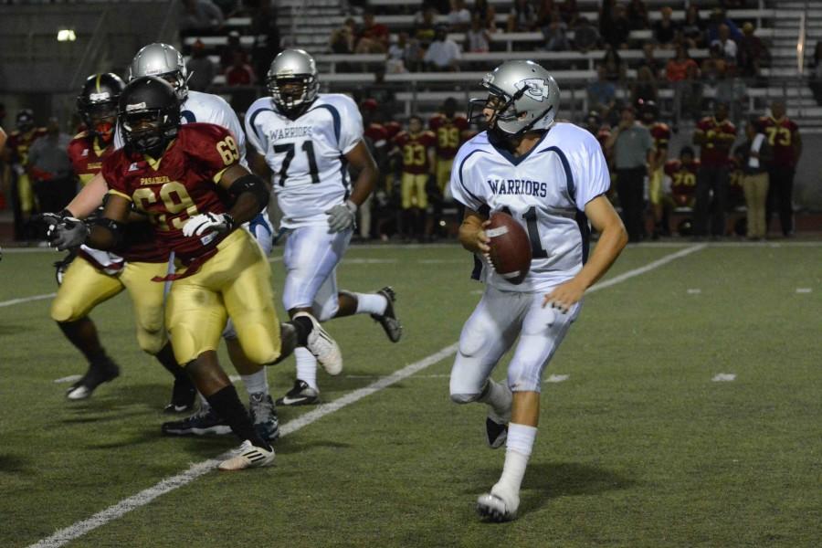Freshman quarterback Jorge Hernandez looks to pass the ball to a teammate during the third quarter against Pasadena City College on Sept. 6. The Warriors defeated the Lancers 37-20.