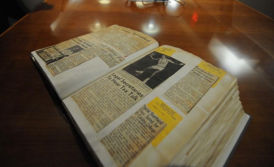 Binded books with newspaper clipping about El Camino College in the library archives room. The library archives houses many pieces of EC history from photos to newspaper clippings and old class catalogs.