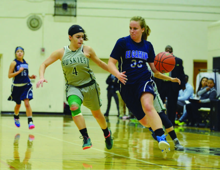 Freshman forward Jill Thebodeau (right) fights for possession of the ball against East Los Angeles College. The Warriors were eliminated from the playoff after losing to the Huskies 70-56 on Wednesday night. Photo credit: John Fordiani
