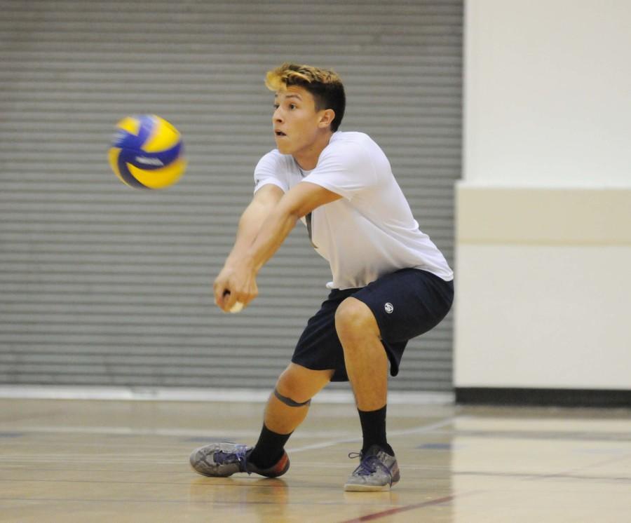 El Camino outside hitter Allen Sarinana digs the ball during the second set versus Moorpark College on April 1. The Warriors defeated the Raiders 3-1 Wednesday night. Photo credit: John Fordiani