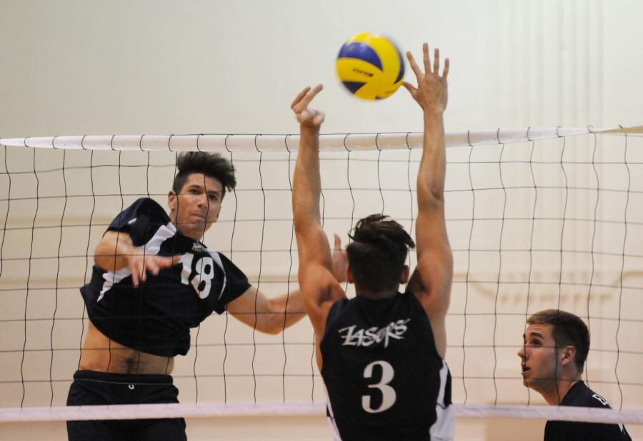 Warriors outside hitter Casey Wood spikes the ball past Irvine Valley College on Friday, April 17. The Warriors defeated the Lasers 3-0 in the first round of the Southern California Regional playoffs. Photo credit: John Fordiani