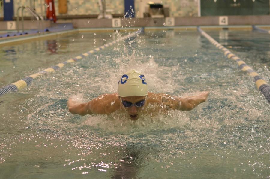Hogan Inscore swims ahead of state championships last week. Inscore broke three school records for the 50 meter butterfly (24.50), the 50-meter breaststroke (26.73), and the 100 breaststroke (57.11) in the conference championships. Photo credit: John Fordiani