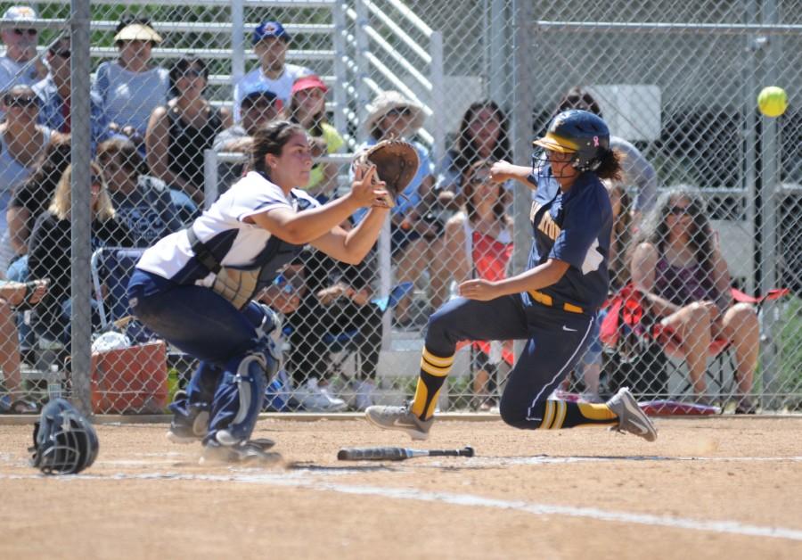 Warriors catcher Gabby Fordiani gets Fullerton College second baseman Andrea Enriquez out at home plate during the third inning on Saturday. The Warriors defeated the Hornets 2-0 in the first round of the playoffs on Saturday afternoon. Photo credit: John Fordiani