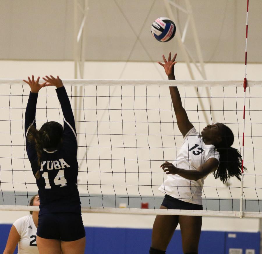 Outside+hitter+Nickeisha+Williams+spikes+the+ball+to+a+Yuba+City+player+during+the+Cerritos+Tournament.+Photo+credit%3A+Jorge+Villa