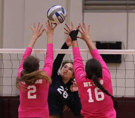 Freshman middle blocker Victoria Curtice attacks the ball over two Mt. SAC defenders. Curtice had three kills and two solo blocks on Friday nights 3-1 (25-17, 18-25, 25-22, 25-23) victory over Mt. SAC. Photo credit: Jo Rankin