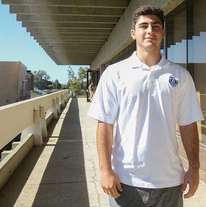 Associated Student Government Trustee Eman Dalili stands outside of the Decathlon Room above the Bookstore on Oct. 28. Dalili is continuing the legacy of his position to work with the board of trustees. Photo credit: Jorge Villa