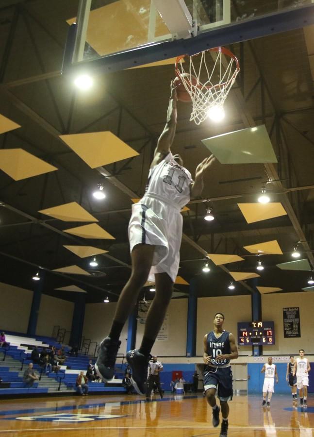 Warriors freshman guard Jason Ball makes the open dunk during Tuesdays home game against Irvine Valley College.The Warriors lost to the Lasers, 70-59, dropping their record for the season to 0-3. Photo credit: Jo Rankin