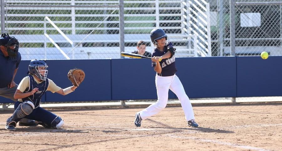 Warrior softball player Vanessa Gutierrez, 19, nursing major, swings the bat as she maintains her eyes on the ball on the Tuesday, March 17 game against Los Angeles Harbor College. Photo credit: Gabriela Better