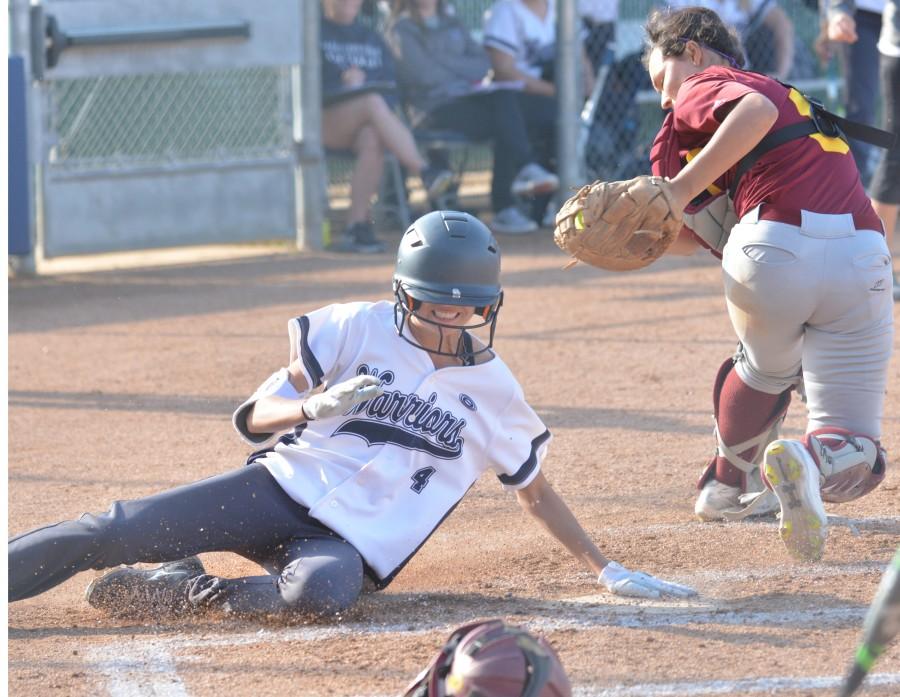 Outfielder Raelani Camez slides into home base after scoring a two-run inside the park homerun in the second inning against Pasadena City College. The Warriors defeated the Lancers 9-1 on Tuesday afternoon. Photo credit: John Fordiani