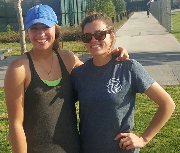 Freshman Taylor Brydon poses with teammate sophomore Brooke Russell after practice.
The two went to South High together and are now partners on the sand. Photo credit: Phil Sidavong