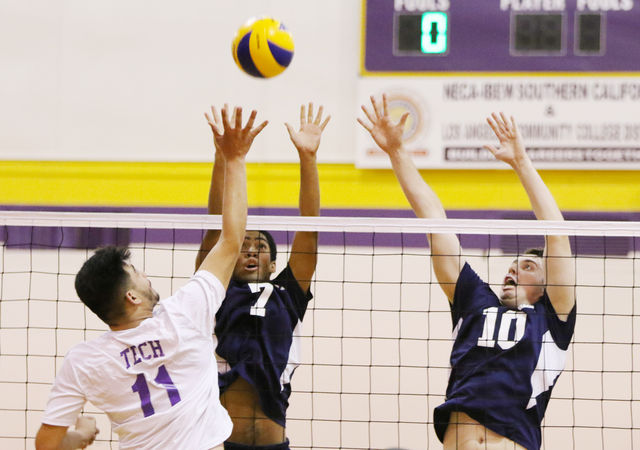 Sophomore middle blockers Kenton Smith (7) and Kris Dixon (10) go up to block the Beavers Jose Landaverdes attack. The Warriors came away with the win after Landaverdes injury forced L.A. Trade Tech College to forfeit during an away game Friday, April 1. Photo credit: Jo Rankin