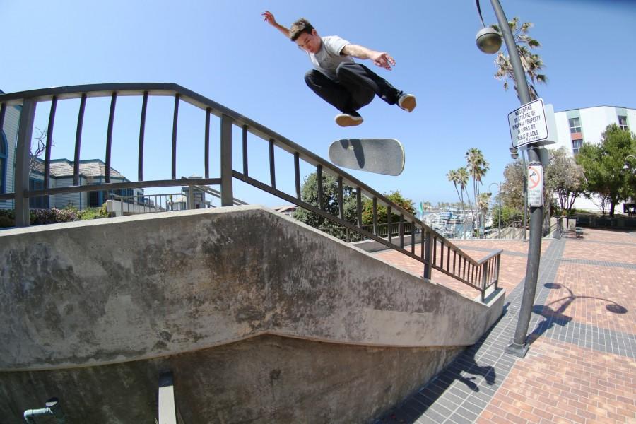 Shane Fithian hucks a backside flip over the rail at Redondo Pier Saturday, April 2. Fithian has been skating since he was 11 and was featured in the local skate video, Goosenectar. Photo credit: Jo Rankin