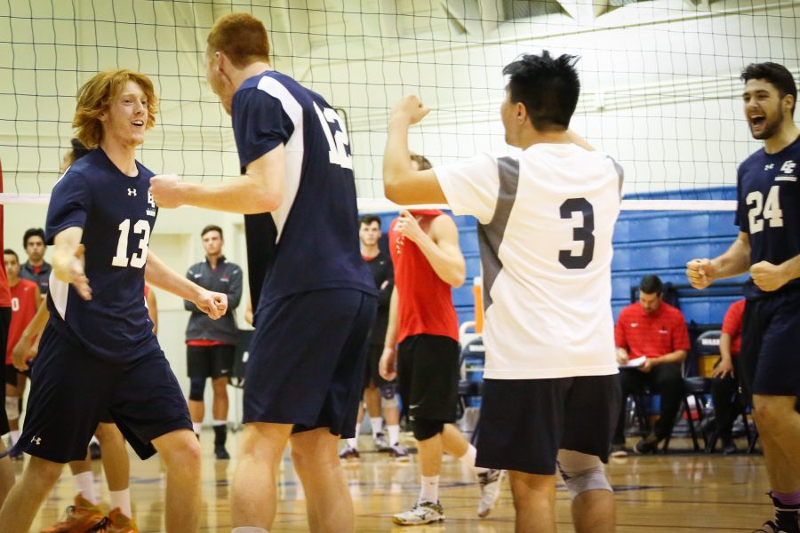 Outside hitter Josh Riblett (from left), middle blocker Peter Nordel, libero Andre Labayen, and setter Michael Otazu celebrate as they tie the game at 8-8 during set four. The Warriors played a home game against the Vikings on April 6. Photo credit: Sue Hong