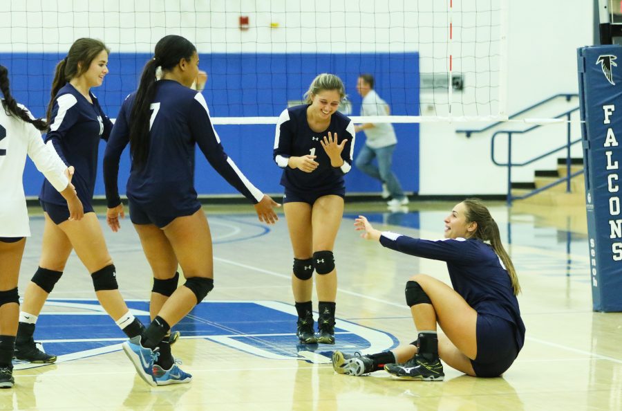 Sophomore opposite Taylor Brydon cant get a ball to go up after diving on the play. The team laughs it off, leading big in the fourth set.
The Warriors would go on to reverse sweep the Cerritos College Falcons. Photo credit: Jo Rankin
