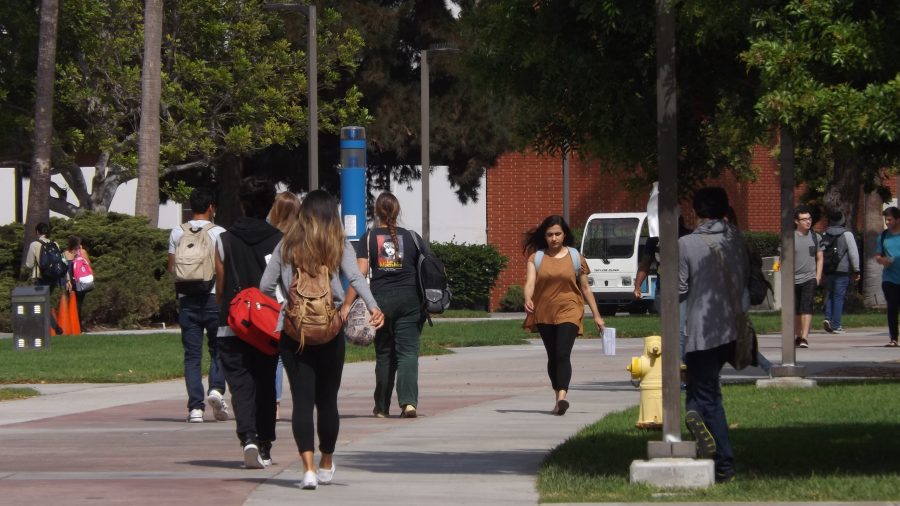 Students walk around campus on Sept. 24. Safety concerns have arisen over the past few semesters with death threats against teachers and administrators from two different former students and even an armed robbery earlier this semester. Photo credit: Shontel Leake
