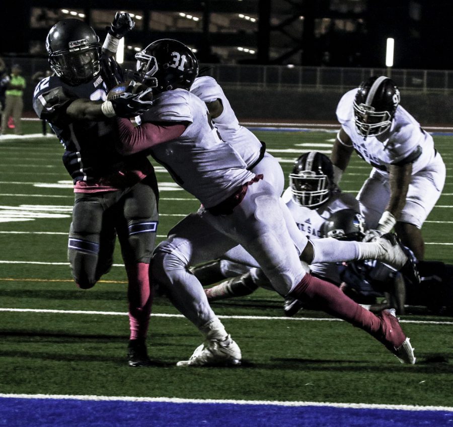 El Camino running back Donovan Davis (No. 22) runs the ball into the end zone for a touchdown during the game against Mt. SAC on Saturday Oct. 23 at El Camino. Photo credit: Jacquelyn  Romano