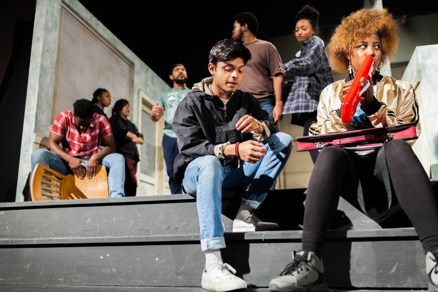 Students get in position as they rehearse the opening act from the first scene in  the upcoming play Does a tiger wear a necktie. Photo credit: Jorge Villa