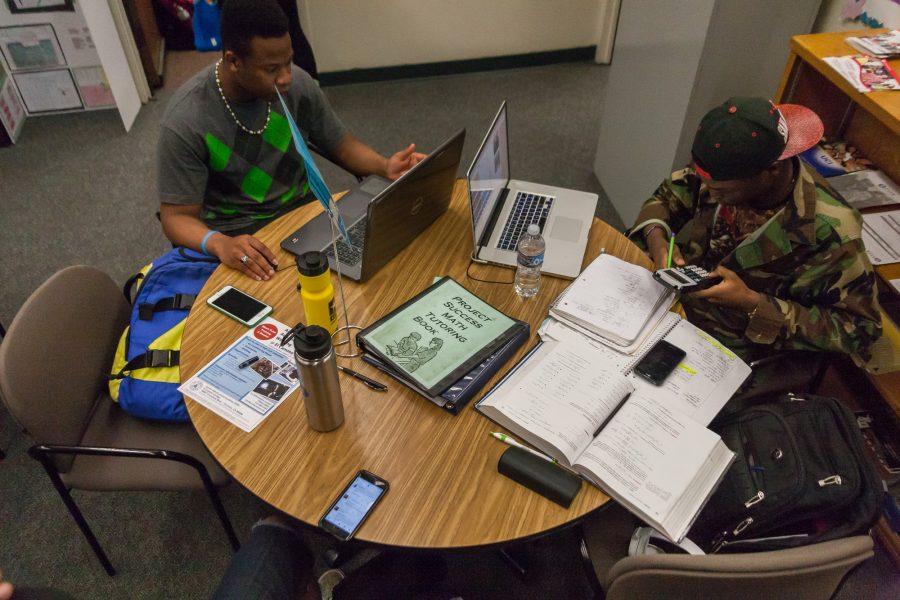 Augustine Akor (20, Biology) & Zane Paully-Umeh (20, Computer Science), both tutors in the Project Success Program, study after mentoring in Student Services Building at El Camino. Photo credit: John Lopez