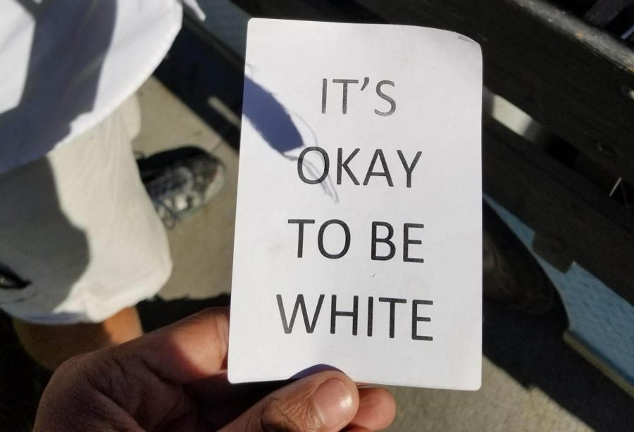 One of the ITS OKAY TO BE WHITE stickers posted around campus on Monday, Nov. 6. Photo credit: Joseph Sanker