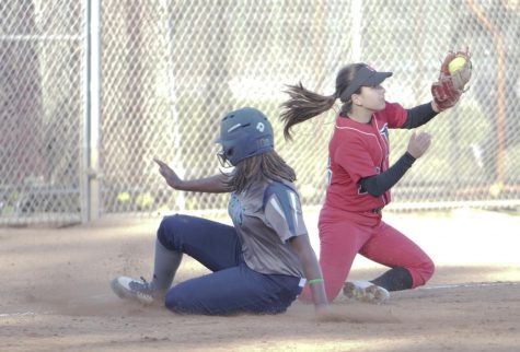 Diamond Lewis slides easily into 3rd base as Long Beach 3rd basement tries to hold onto the softball on Tuesday, Feb. 27. Photo credit: David Gonzalez