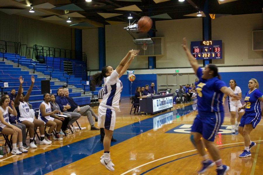 Brenna Wilson shoots a 3 point shot in the 4th quarter. Photo credit: Jeremy Taylor