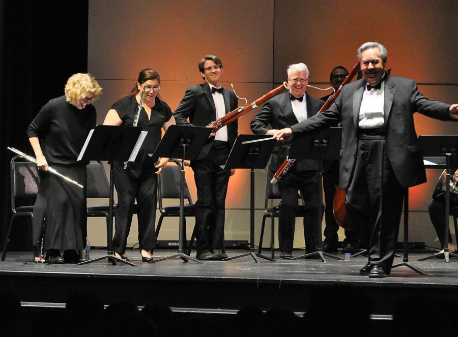 The conductor, Hector Salazar (right) and all the musicians getting an applause end of the performance at ECC Campus Theatre on Saturday, April 21. Photo credit: Miyung Kim